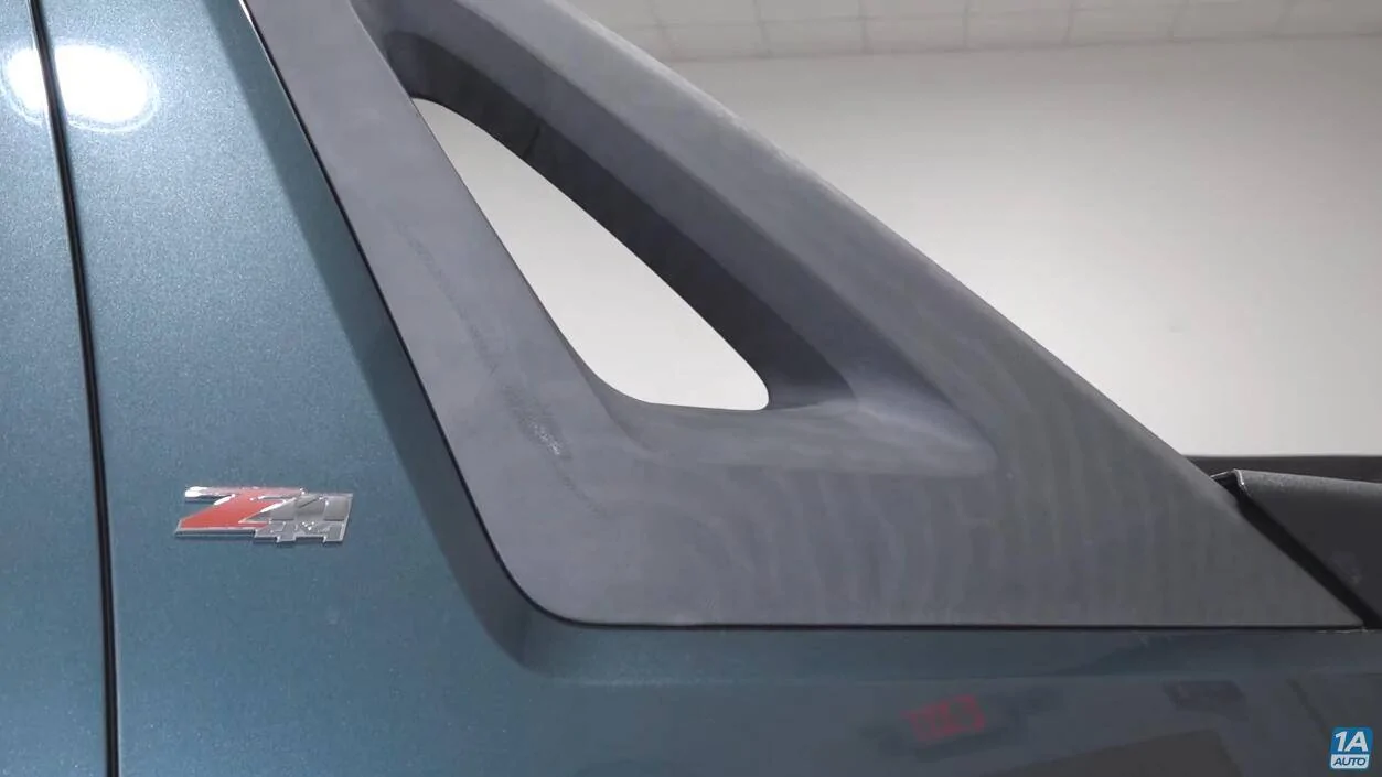 Slate Auto Pickup Truck Embracing Visible Wear and Tear (Shark Battle Scars) 1749805343425-06