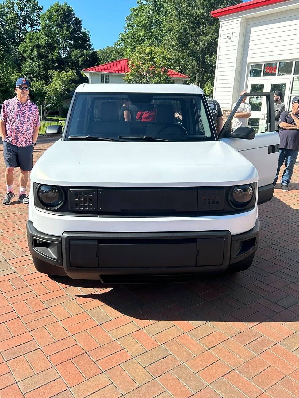 Slate Auto Pickup Truck Your questions answered AND 360 photos! (saw white Slate & met team members in Warsaw) Pearl white Slate truck wrap 1
