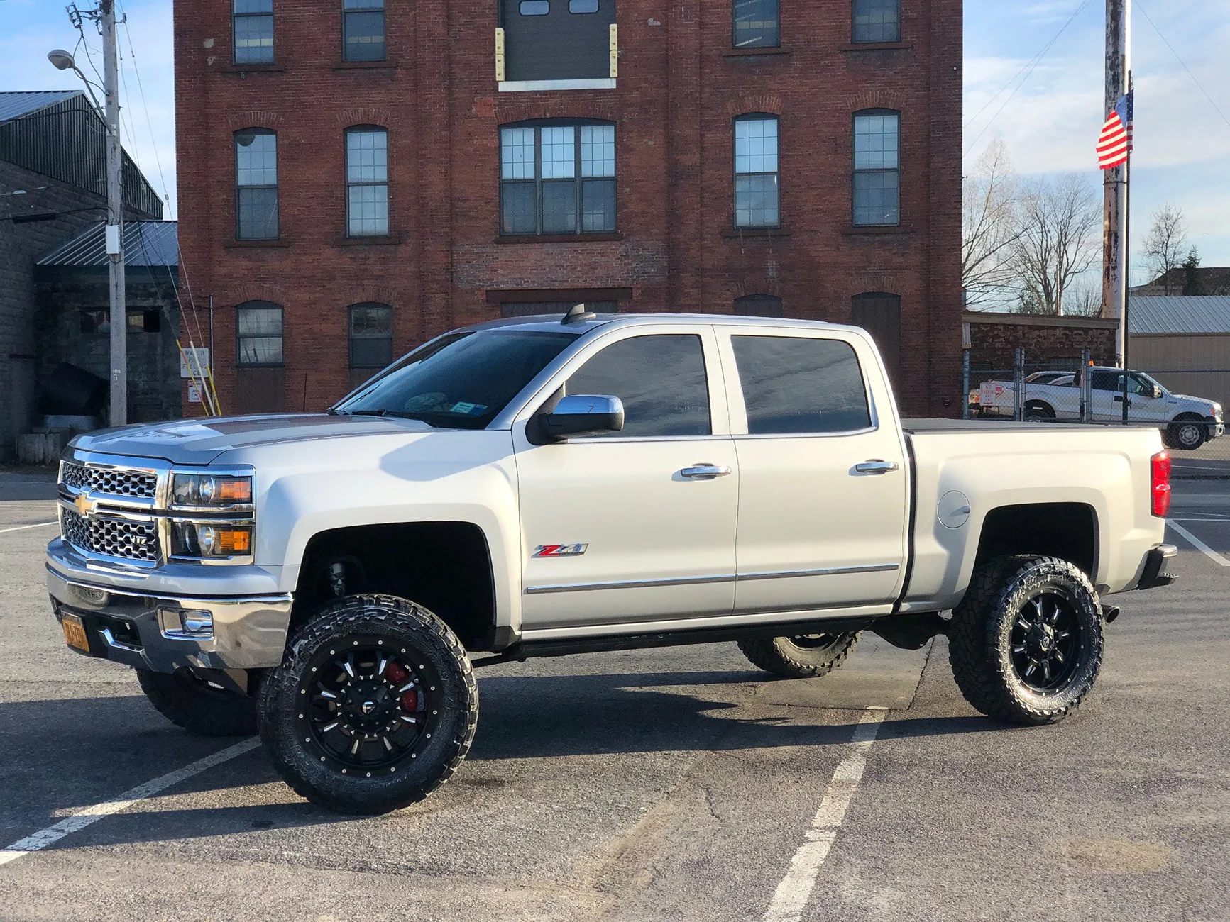 Slate Auto Pickup Truck Suspension Poll: Lifted, Lowered, or Standard Height? 1123350-2-2015-silverado-1500-chevrolet-pro-comp-suspension-lift-6in-fuel-assault-black