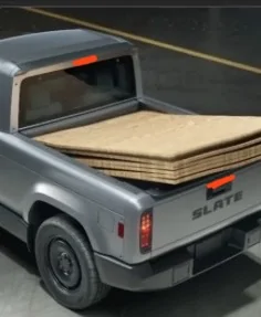 Slate Auto Pickup Truck New pics show updated center console, new speaker (radio?) dashboard panel, carrying plywood with tailgate up IMG_4315