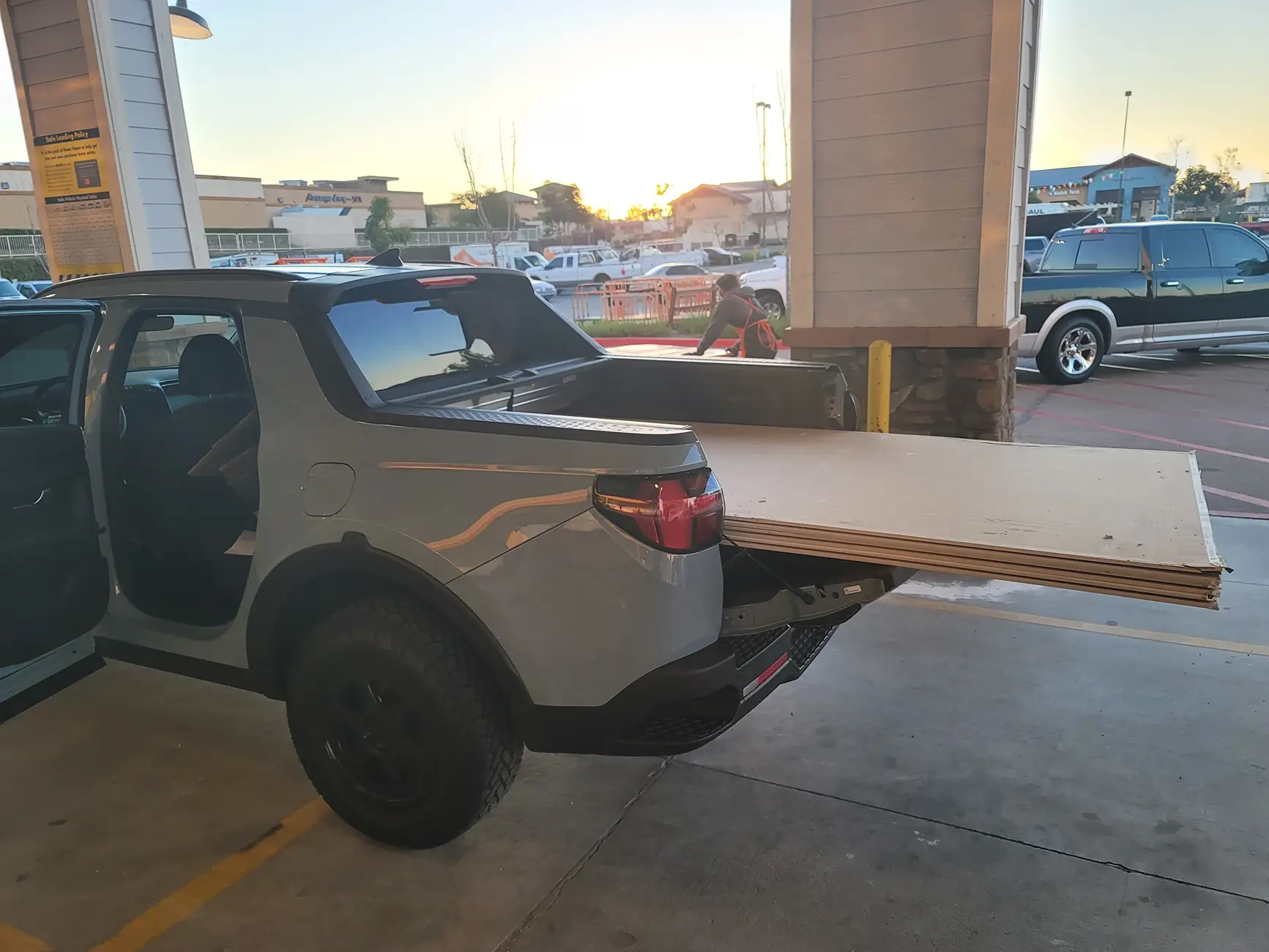 Slate Auto Pickup Truck New pics show updated center console, new speaker (radio?) dashboard panel, carrying plywood with tailgate up 1781969234192-rf