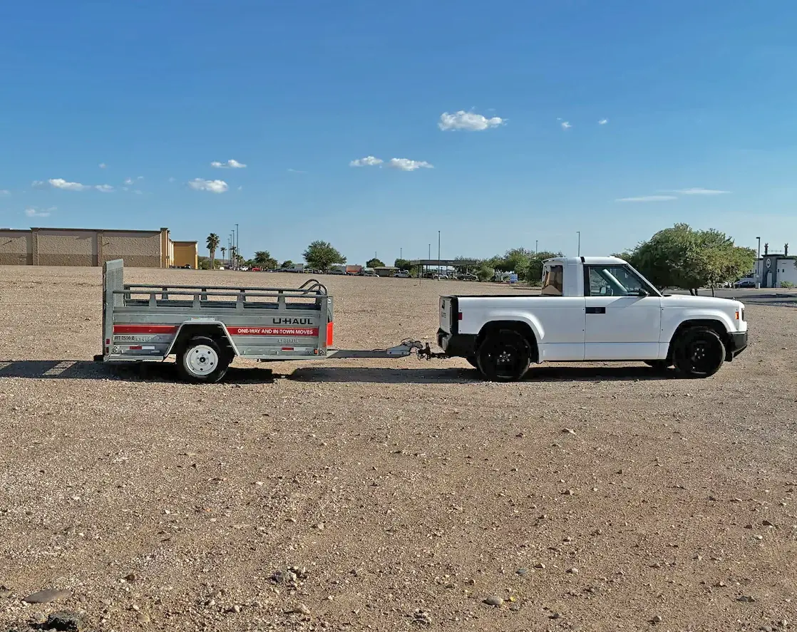Slate Auto Pickup Truck White Slate towing U-Haul trailer (hot weather testing photos)! Mater's had a rough life . slate-truck-tow-uhaul-trailer-test-2