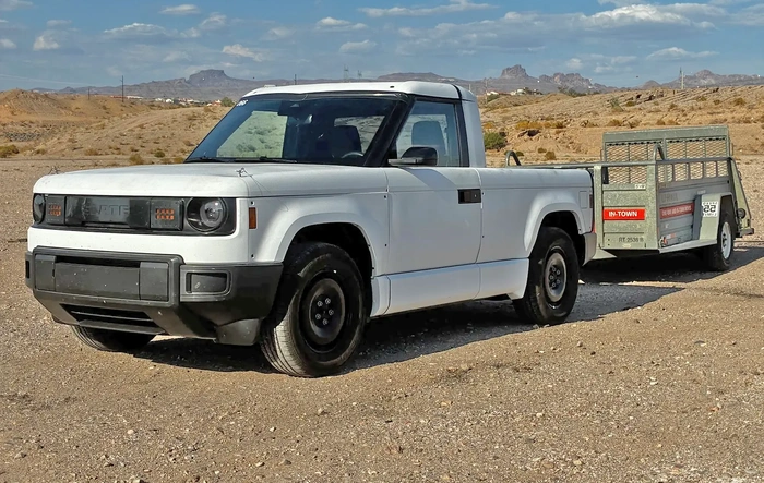 White Slate towing U-Haul trailer (hot weather testing photos)! Mater's had a rough life .